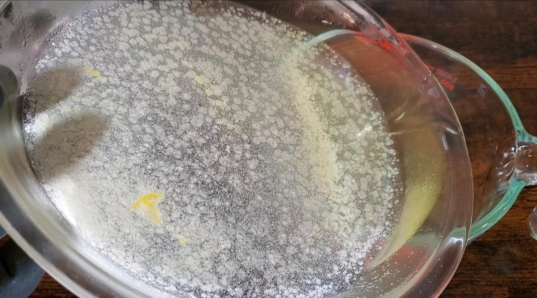 Pouring the remaining solvent off of the crystals slowly to allow the floaters to stick to the side of the dish