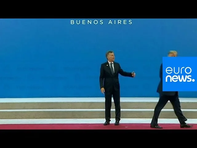 Watch: Argentine president left standing awkwardly after Trump wanders off